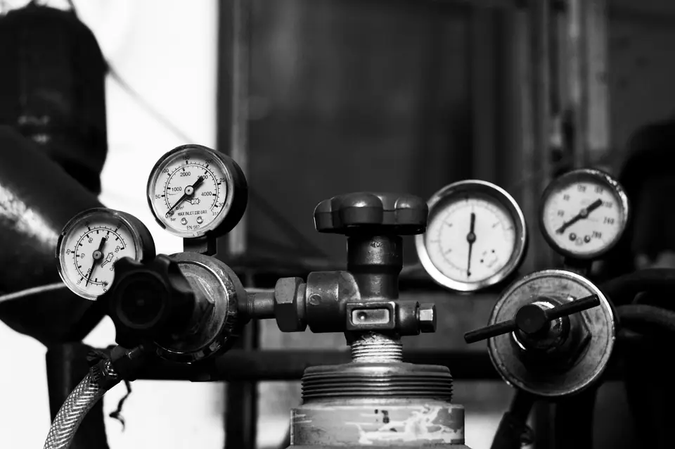 Pressure gauges and regulators in black and white