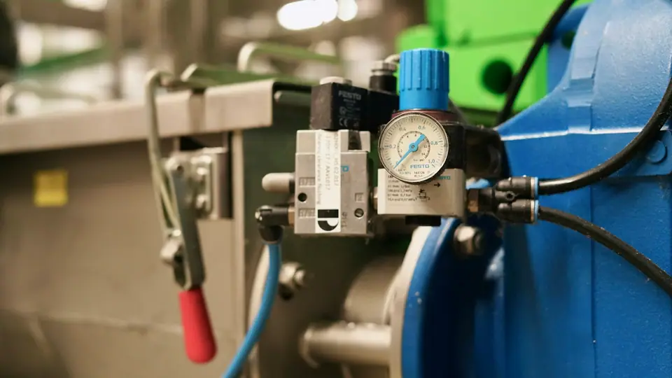 Solenoid valve with pressure regulator and gauge on a machine